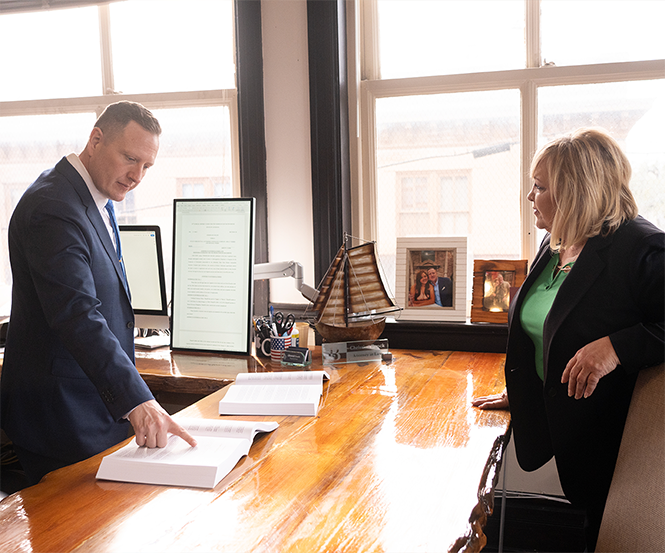 Lisa and Christian in a meeting for a personal injury case